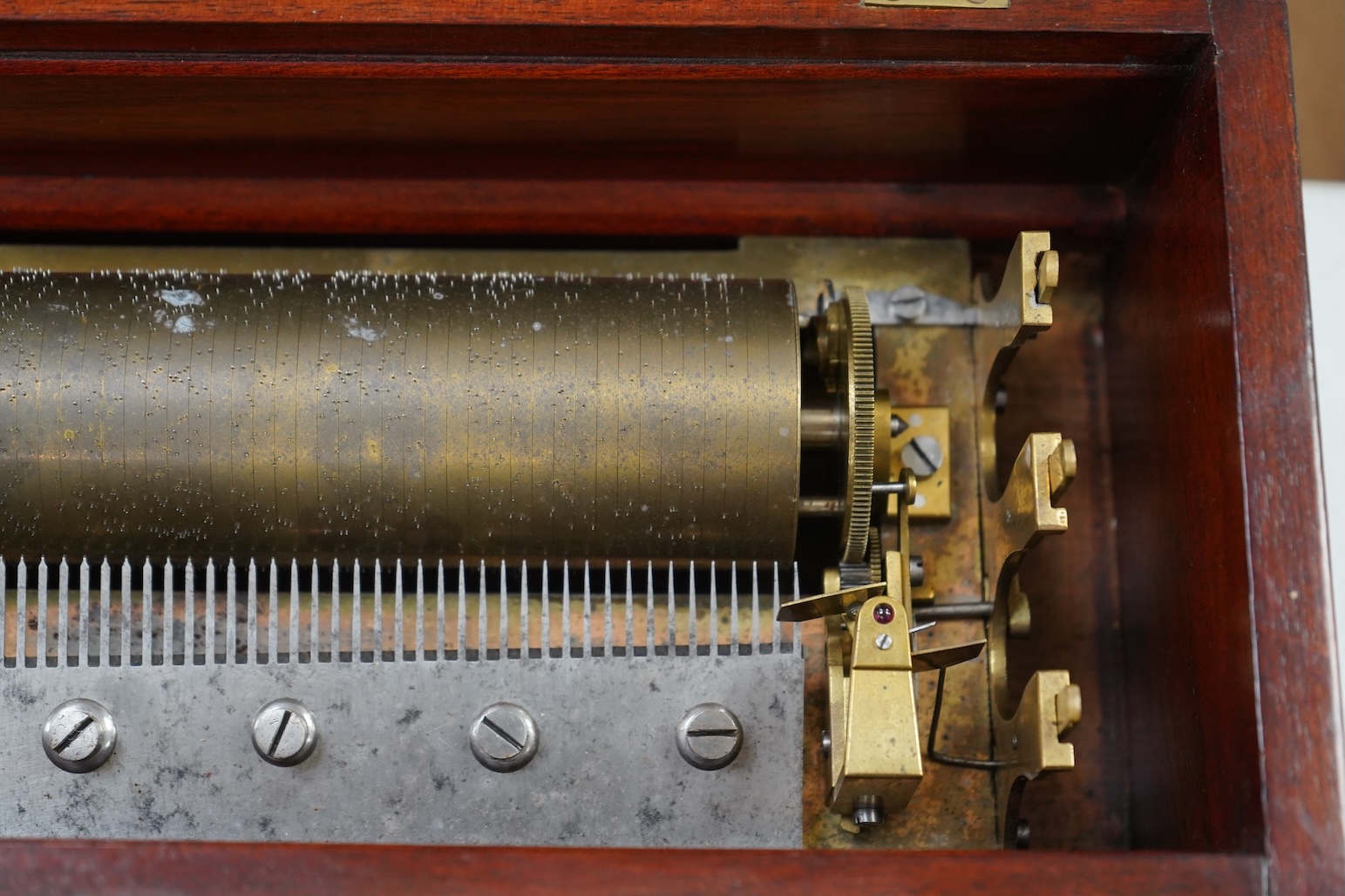 A 19th century Swiss rosewood and marquetry cased cylinder music box, by Nicole Freres, with engraved serial number 11039, the cylinder is 32.5cm long, the case; 51cm wide, 15cm high, 17cm deep